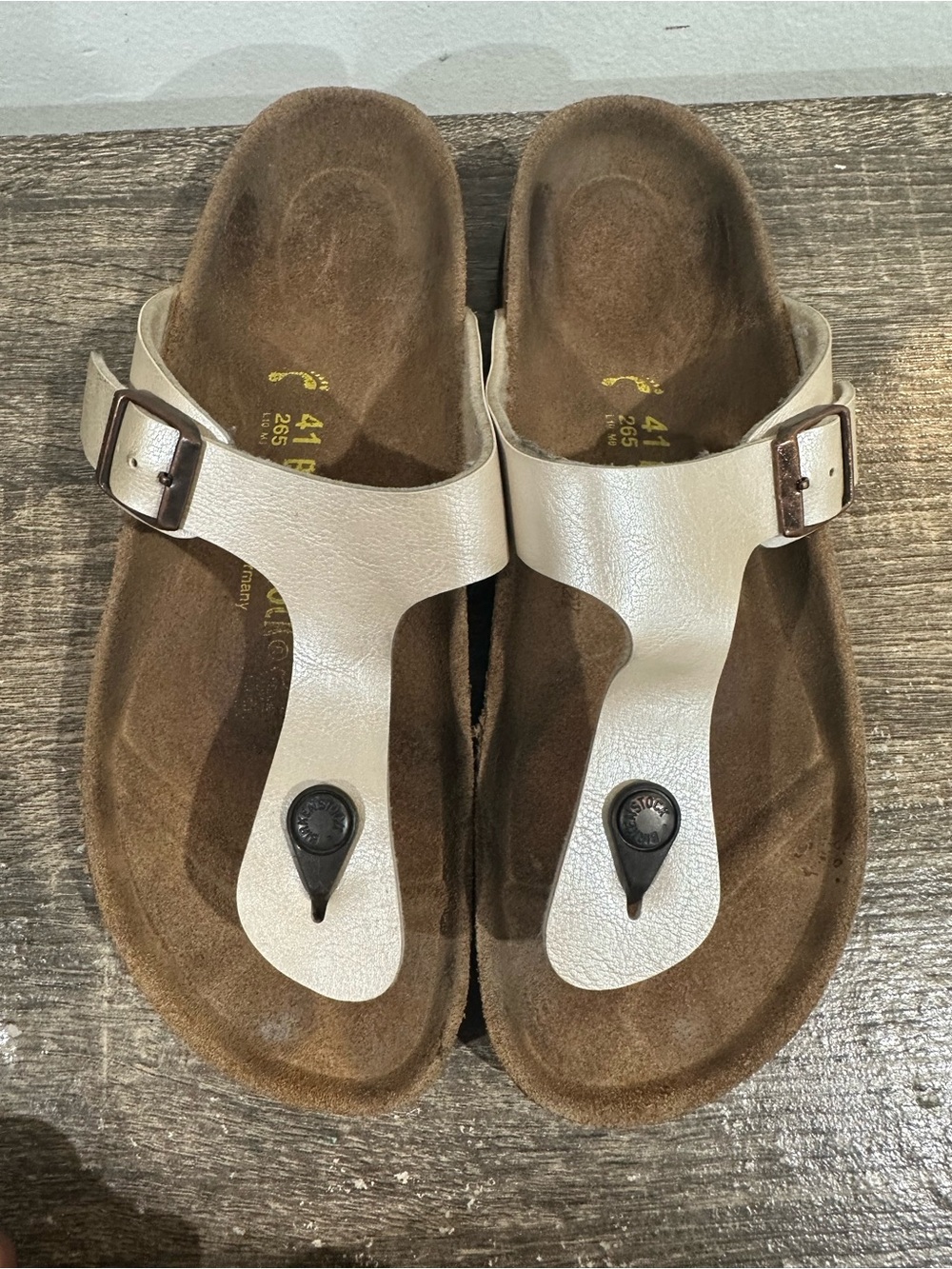 Birkenstock Cream Leather T-Strap Sandals with Bronze Buckle